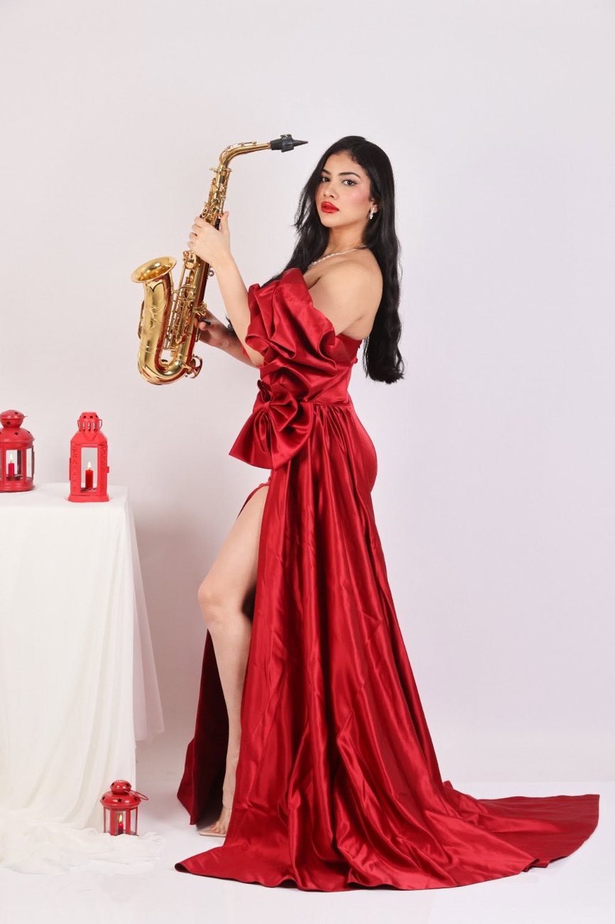 Portrait in a red gown with saxophone